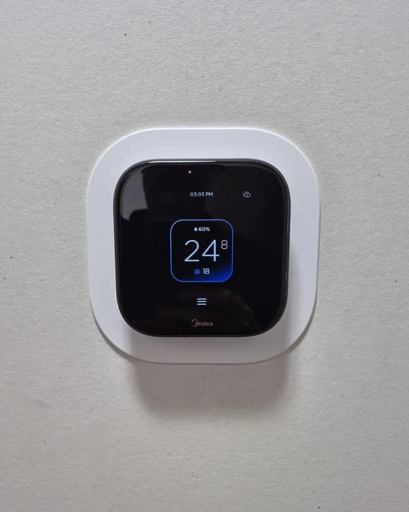 Smart thermostat on a wall
